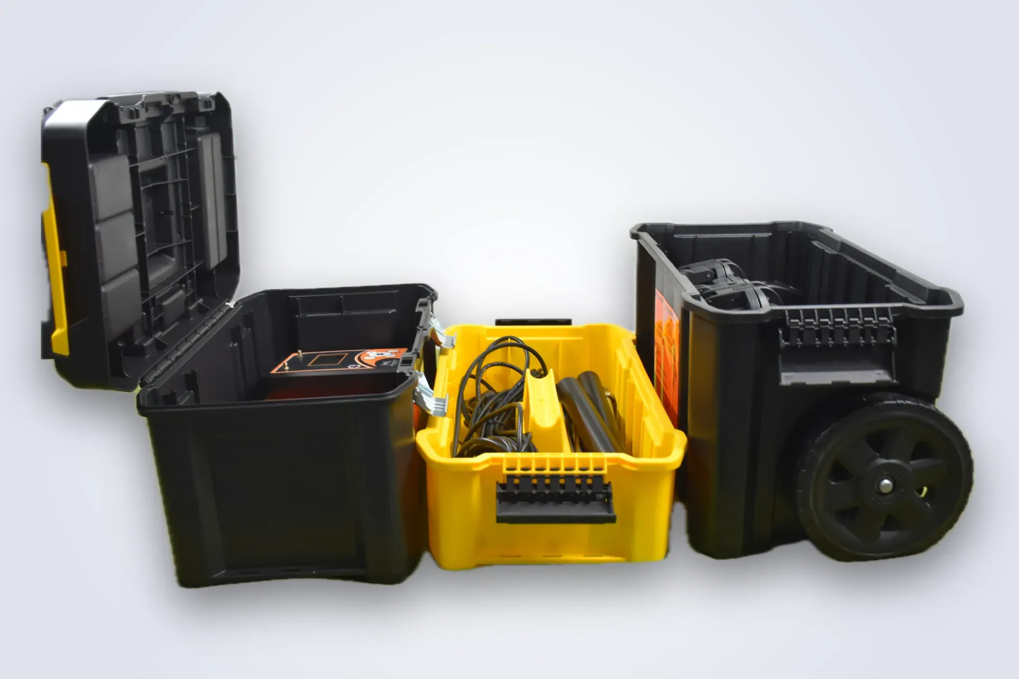 The Max S 500 rolling case opened out: the top box with the Lora 750 console and S-500 host unit, the yellow middle tray of cables and electrode rods, and the wheeled bottom bin holding the ADS-IP hard case